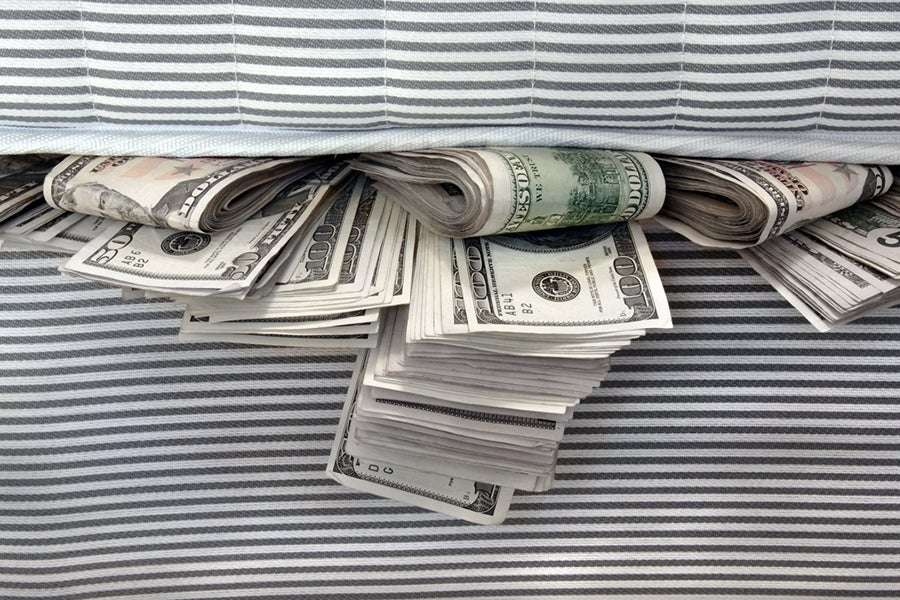 Cash stashed for safe keeping in between mattresses.