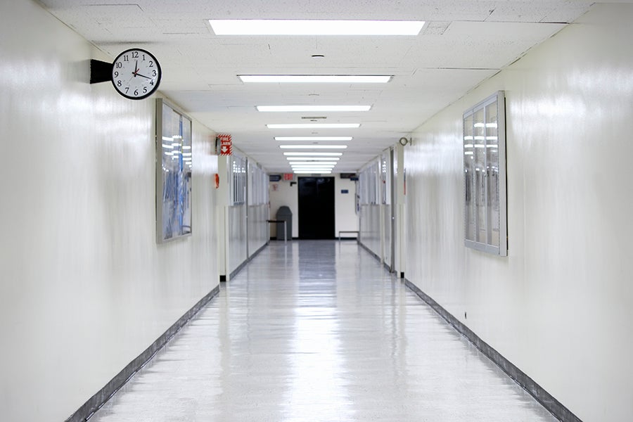 An empty hallway with a clock
