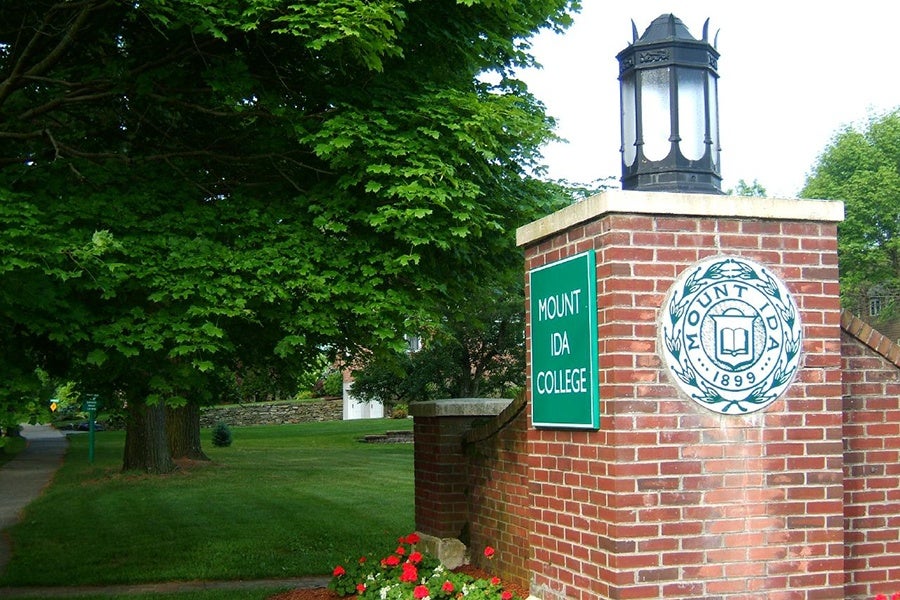 The Mount Ida college crest