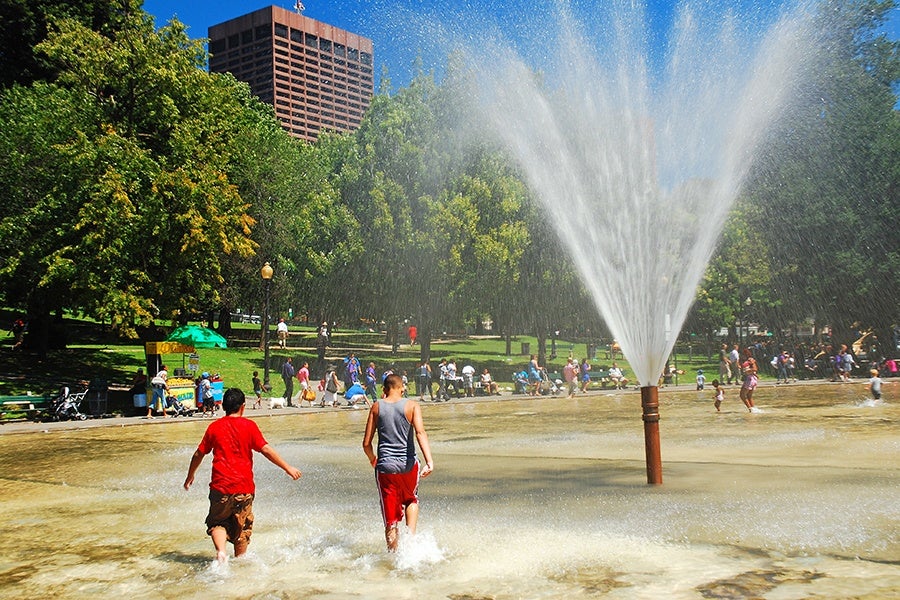 Boston, MA, USA August 10, 2011 Two Teens Cool off during a warm summer day in Boston Common.
