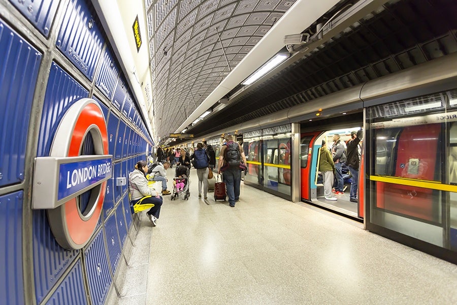 London, UK - September 21, 2013: People on the London Bridge station platform in London.