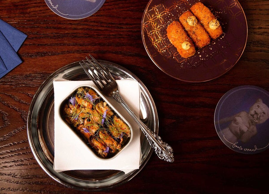 Chilled mussels with fennel, burnt lemon, and Champagne vinaigrette; and black pepper corn pudding croquettes at Fool's Errand