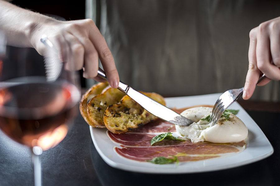 Creamy burrata and prosciutto at dbar