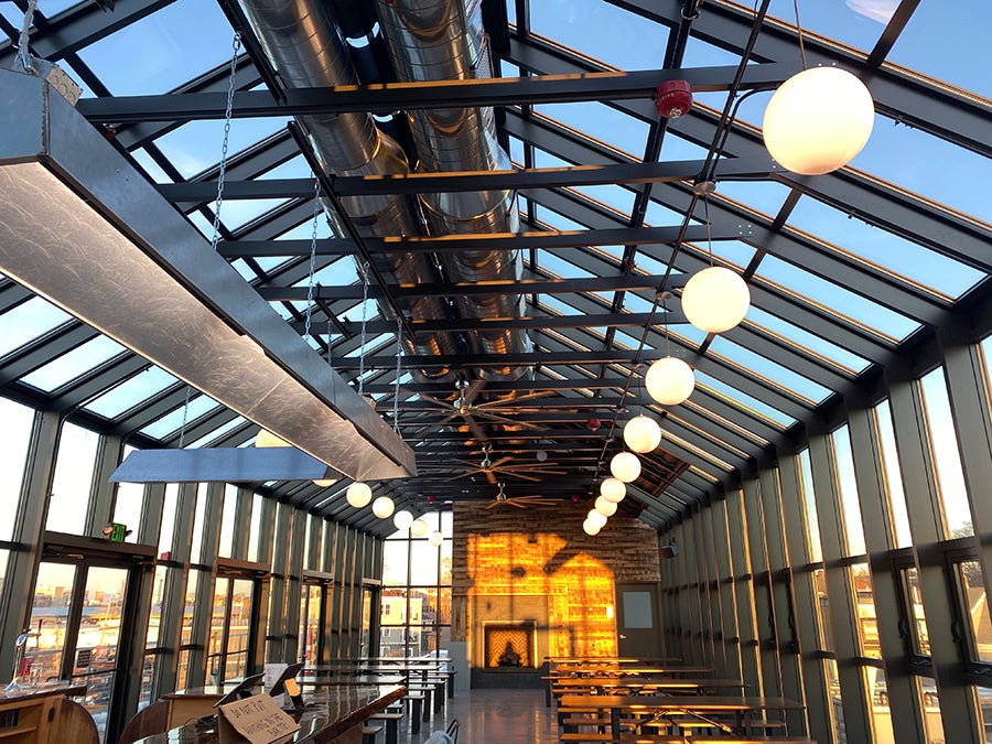 Glass-walled rooftop beer hall at Dorchester Brewing Company