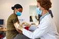 woman getting a vaccine