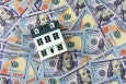 House Model on Top Of Bunch of Money