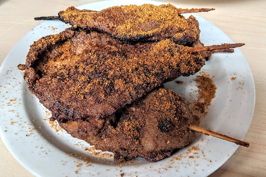 Big pieces of beef are grilled and served on skewers, dusted with a spicy powder.