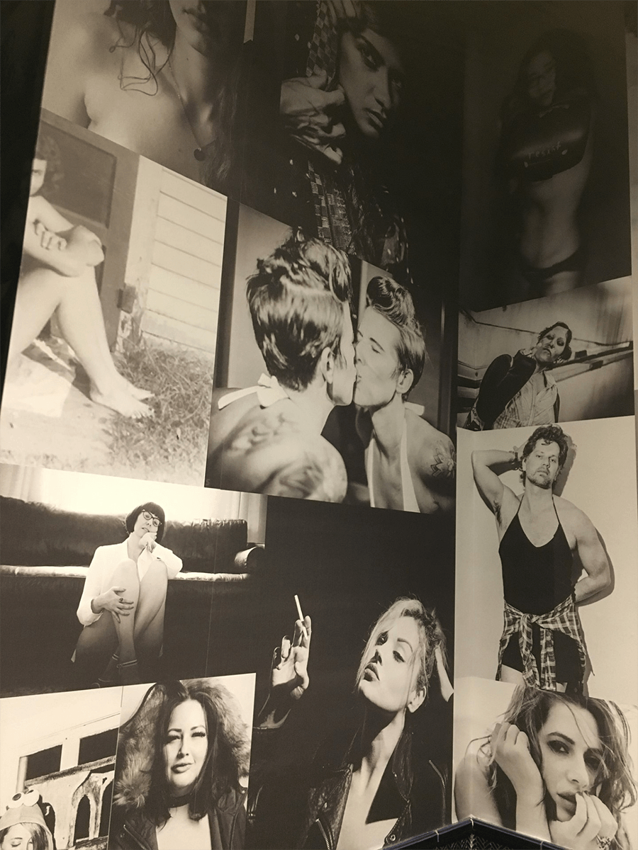 Closeup of a serious of black and white photos of people on a wall.