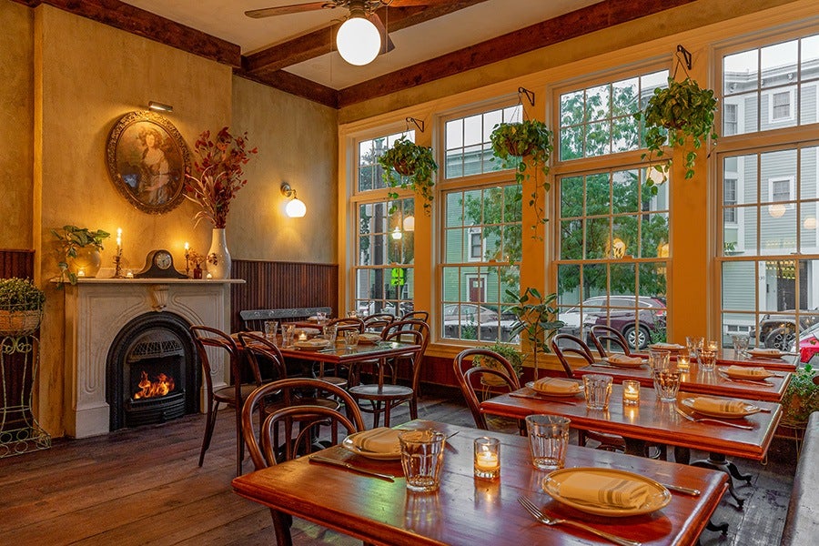 A dining room at Waverly with fireplace.