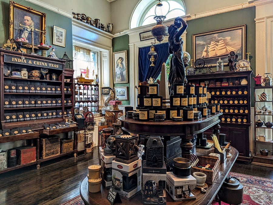 The interior of a shop full of antiques, teas, soaps, and more.