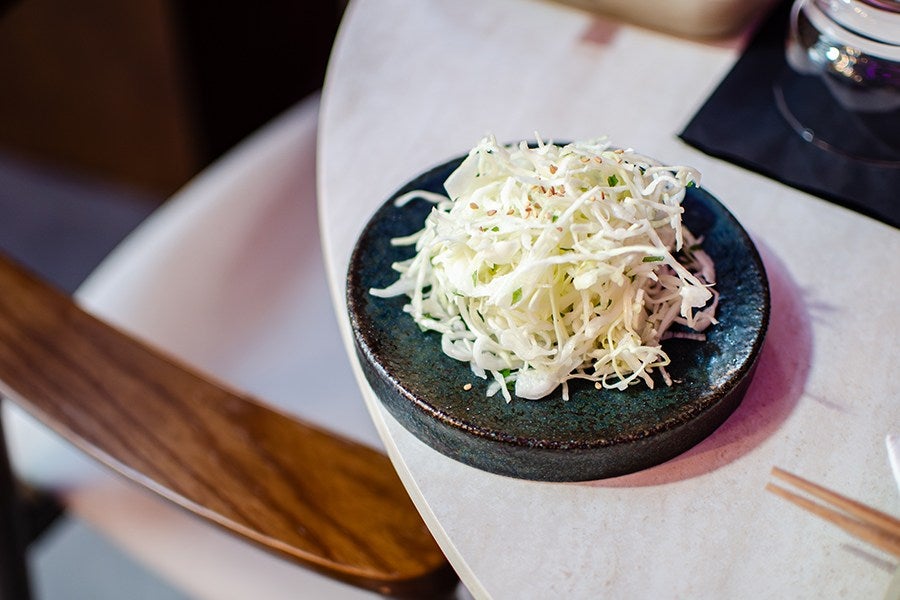 A small, simple salad of shredded cabbage.