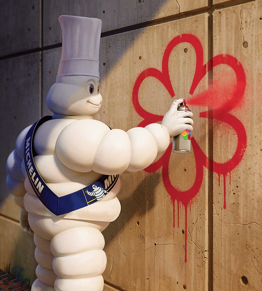 A Michelin Man character wearing a chef's hat and a blue sash with "MICHELIN" written on it is spray painting a red flower on a concrete wall. The spray paint is dripping slightly, and the character is smiling while holding the spray can.
