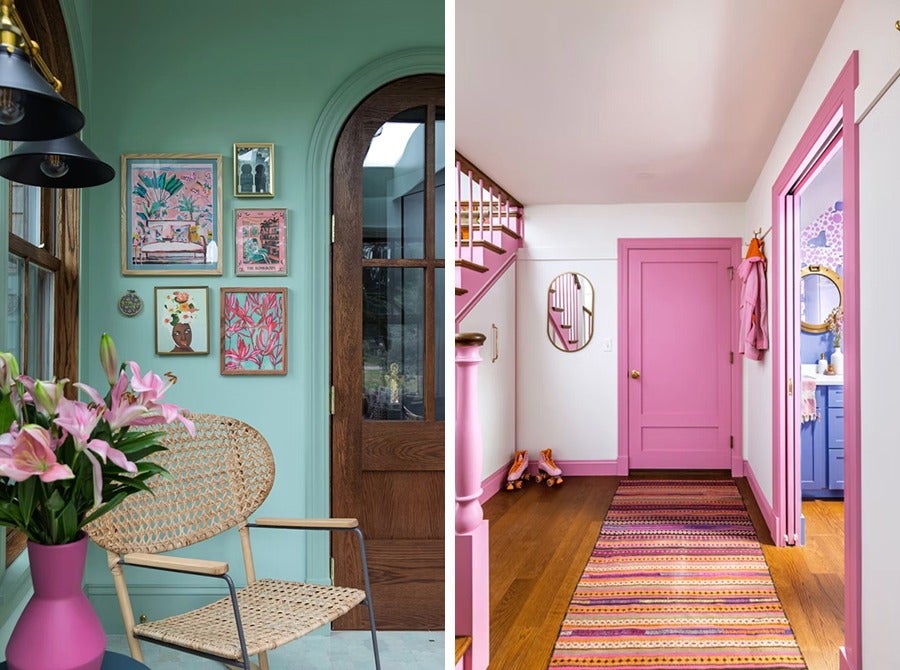 Left side: A cozy corner with a woven rattan chair, a pink vase holding pink lilies, and a mint green wall adorned with six framed artworks in various sizes and colors. A wooden door with glass panels is partially visible. Right side: A hallway with pink trim, a pink door, and a pink stair railing. A striped rug with pink, orange, and purple tones runs along the wooden floor. Pink roller skates rest near the wall, and a small oval mirror hangs beside the door. A glimpse of a blue bathroom with a round mirror is visible through an open doorway.
