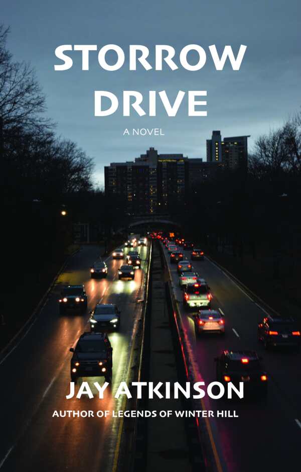Storrow Drive: A novel by Jay Atkinson, featuring a nighttime city scene with cars driving on a wet road, their headlights and taillights reflecting on the pavement, framed by dark trees and tall buildings in the background.