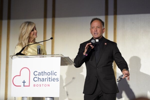 CBS News Anchor Paula Ebben and Father John Unni