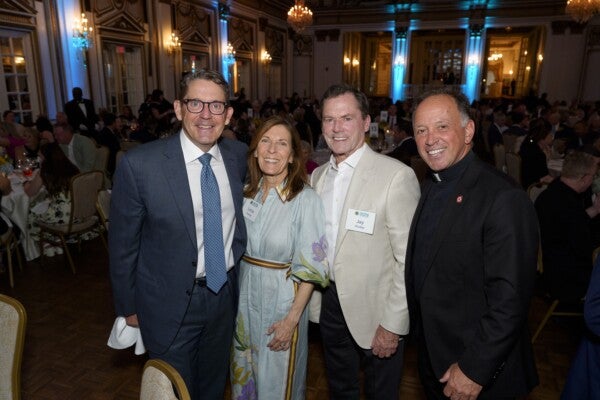 Liberty Mutual's Tim Sweeney, Linda Hooley, Jay Hooley and Father John Unni